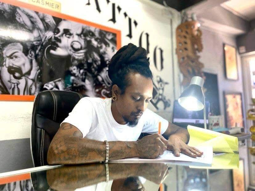 Vicky Mannick tattooing a client at Glamour Tattoo Studio, Grand Baie, Mauritius